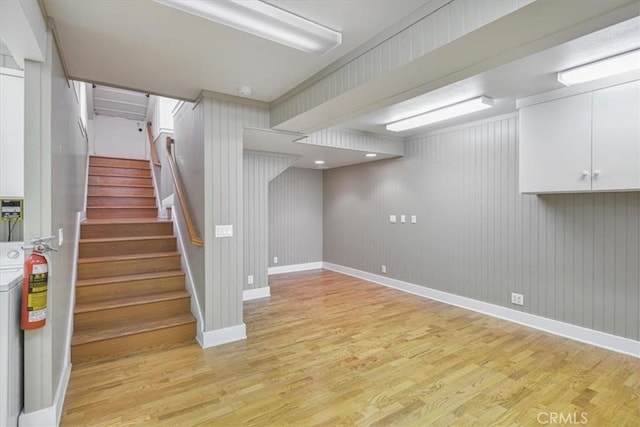 625 High Dr, Laguna Beach, CA 92651 - finished basement with light wood-style flooring, stairway, and washer / clothes dryer