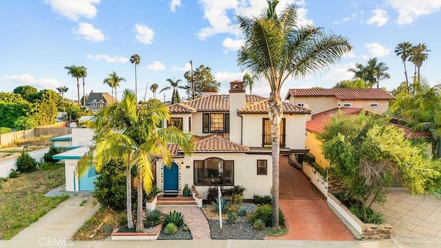 34283 Via Lopez, Dana Point, CA 92624 - mediterranean / spanish house with stucco siding, a tiled roof, driveway, and a chimney