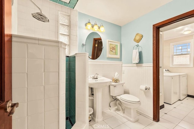 34283 Via Lopez, Dana Point, CA 92624 - bathroom with washer and dryer, a stall shower, tile patterned floors, and wainscoting
