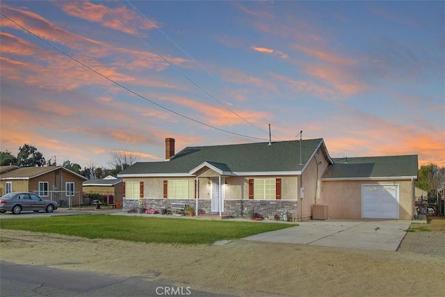 4234 Center Ave, Norco, CA 92860 - ranch-style home featuring stone siding, driveway, stucco siding, a front yard, and an attached garage