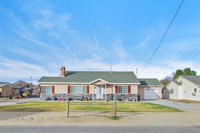 4234 Center Ave, Norco, CA 92860 - ranch-style house featuring stone siding, a chimney, driveway, and an attached garage