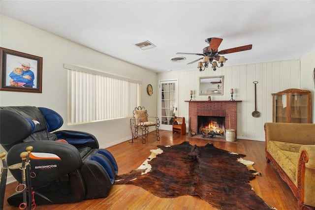 4234 Center Ave, Norco, CA 92860 - living area featuring wood finished floors, ceiling fan, and a brick fireplace