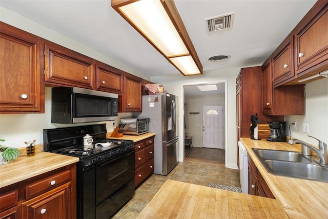 4234 Center Ave, Norco, CA 92860 - kitchen featuring stainless steel appliances and wood counters