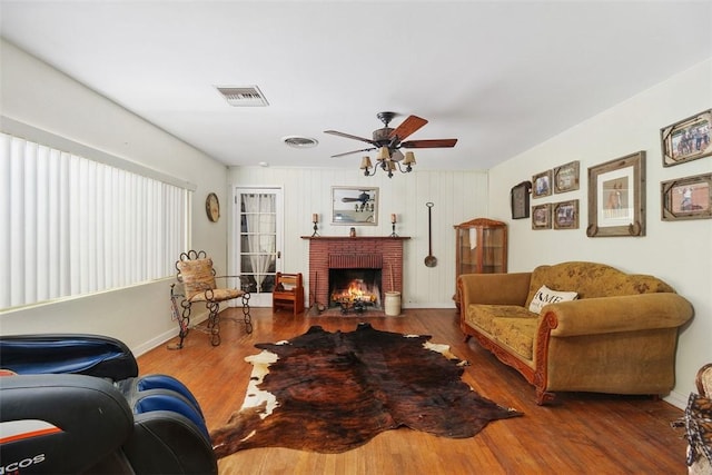 4234 Center Ave, Norco, CA 92860 - living room with wood finished floors, a brick fireplace, and a ceiling fan