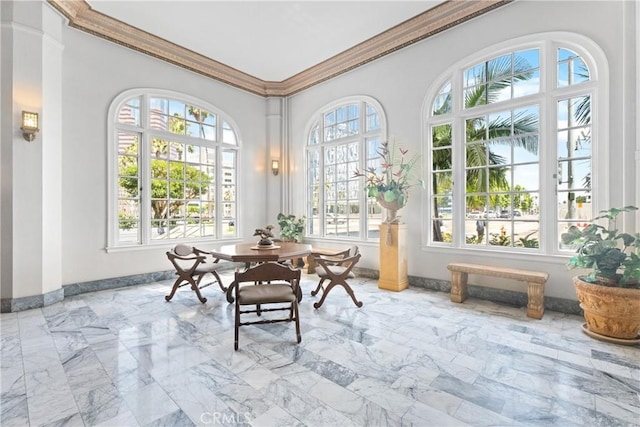 360 W Ocean Blvd Unit 1103, Long Beach, CA 90802 - dining space with healthy amount of natural light, ornamental molding, and marble finish flooring