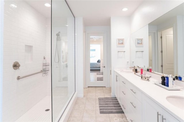 32096 Hyacinth Way, Temecula, CA 92591 - ensuite bathroom featuring double vanity, a walk in shower, tile patterned floors, and recessed lighting