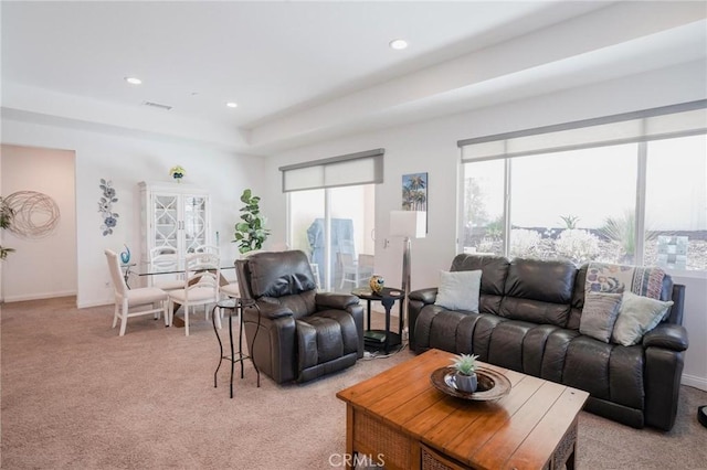 32096 Hyacinth Way, Temecula, CA 92591 - living room with light colored carpet, recessed lighting, and a raised ceiling