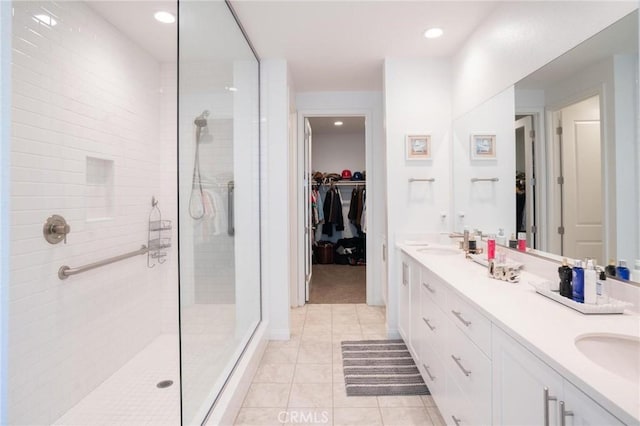 32096 Hyacinth Way, Temecula, CA 92591 - full bathroom with a spacious closet, double vanity, walk in shower, tile patterned floors, and recessed lighting
