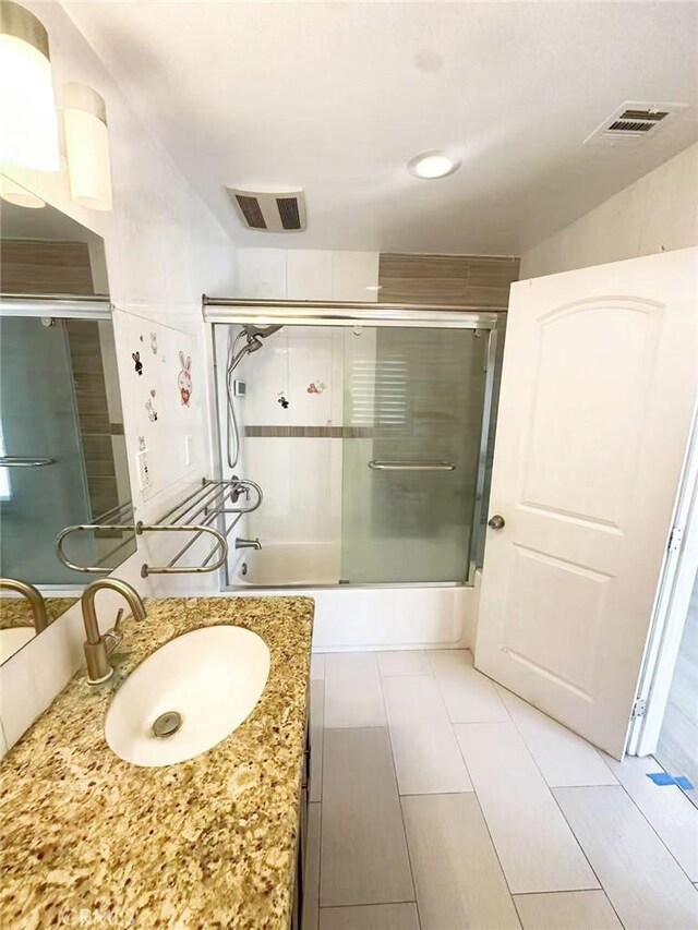 528 S Avington Ave, West Covina, CA 91790 - full bath featuring vanity and bath / shower combo with glass door