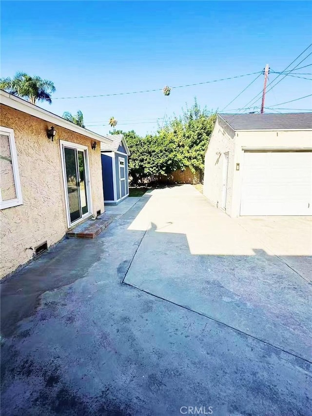 528 S Avington Ave, West Covina, CA 91790 - view of patio with a storage shed and a garage