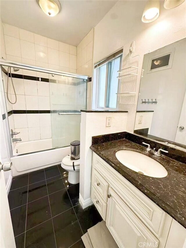 528 S Avington Ave, West Covina, CA 91790 - full bath featuring tile patterned floors, vanity, and combined bath / shower with glass door