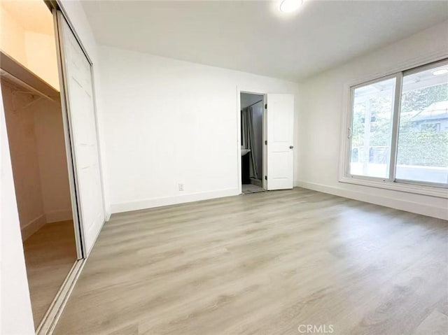 528 S Avington Ave, West Covina, CA 91790 - unfurnished bedroom featuring light wood finished floors and a closet