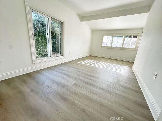 528 S Avington Ave, West Covina, CA 91790 - spare room with healthy amount of natural light and wood finished floors