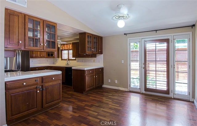 267 E 16th St, Costa Mesa, CA 92627 - kitchen with lofted ceiling, dark wood-style floors, healthy amount of natural light, and glass insert cabinets