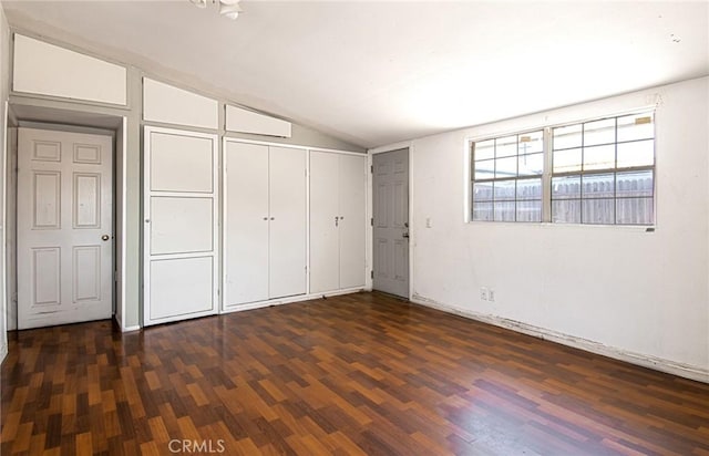 267 E 16th St, Costa Mesa, CA 92627 - unfurnished bedroom featuring lofted ceiling, dark wood-style flooring, and a closet