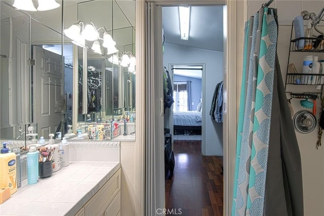 267 E 16th St, Costa Mesa, CA 92627 - ensuite bathroom featuring wood finished floors, vanity, lofted ceiling, and a shower with curtain