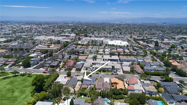 267 E 16th St, Costa Mesa, CA 92627 - aerial view of property and surrounding area with a mountain backdrop and nearby suburban area