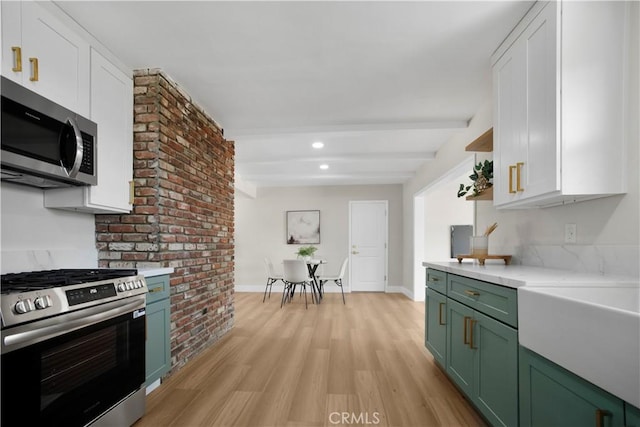 1347 W Princeton St, Ontario, CA 91762 - kitchen with appliances with stainless steel finishes, green cabinets, beam ceiling, light countertops, and light wood-style flooring