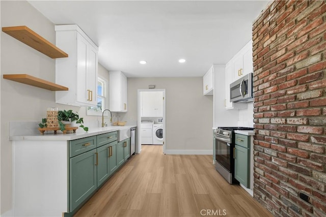 1347 W Princeton St, Ontario, CA 91762 - kitchen featuring stainless steel appliances, green cabinetry, independent washer and dryer, light wood finished floors, and brick wall