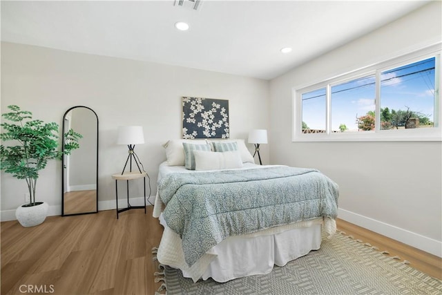 1347 W Princeton St, Ontario, CA 91762 - bedroom with light wood finished floors and recessed lighting