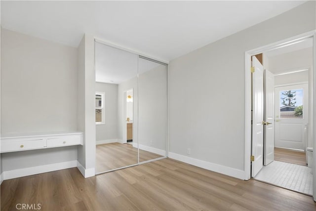 1347 W Princeton St, Ontario, CA 91762 - unfurnished bedroom with wood finished floors and a closet