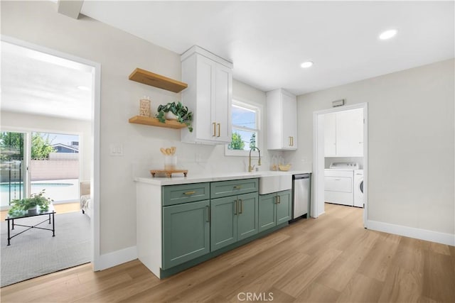1347 W Princeton St, Ontario, CA 91762 - kitchen with green cabinets, independent washer and dryer, stainless steel dishwasher, light wood-style floors, and plenty of natural light