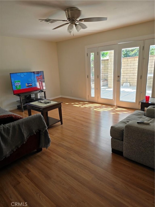 4163 Stotts St, Riverside, CA 92503 - living room with wood finished floors, ceiling fan, and french doors