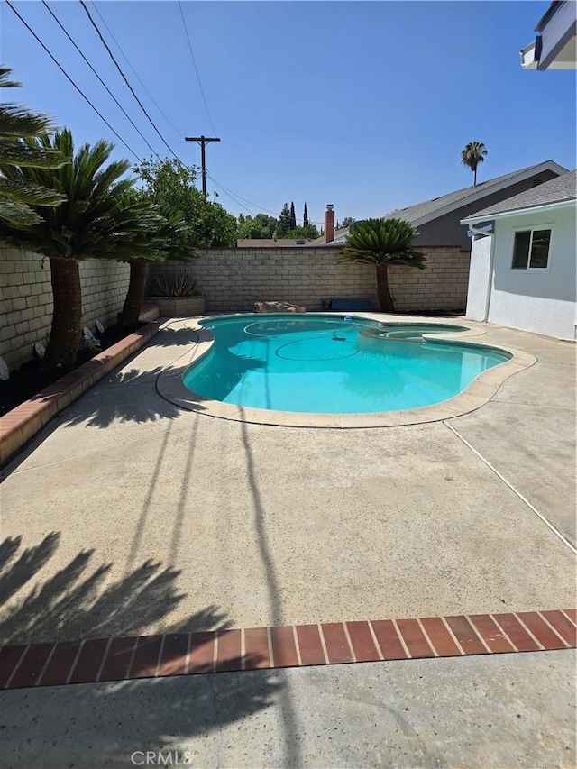 4163 Stotts St, Riverside, CA 92503 - view of swimming pool featuring a fenced backyard and a patio