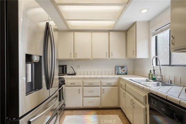 304 S Minnesota Ave, Glendora, CA 91741 - kitchen featuring black appliances, cream cabinets, tile counters, and recessed lighting