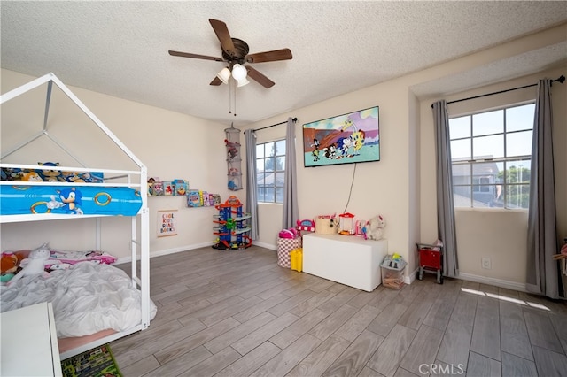 818 Live Oak Pl, Corona, CA 92882 - bedroom with wood finished floors, a textured ceiling, and a ceiling fan