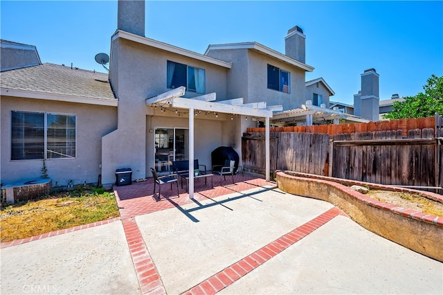 818 Live Oak Pl, Corona, CA 92882 - rear view of property featuring a pergola, a patio, stucco siding, a fenced backyard, and a chimney