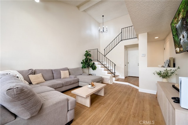 818 Live Oak Pl, Corona, CA 92882 - living room featuring light wood-style flooring, beamed ceiling, stairway, a chandelier, and high vaulted ceiling