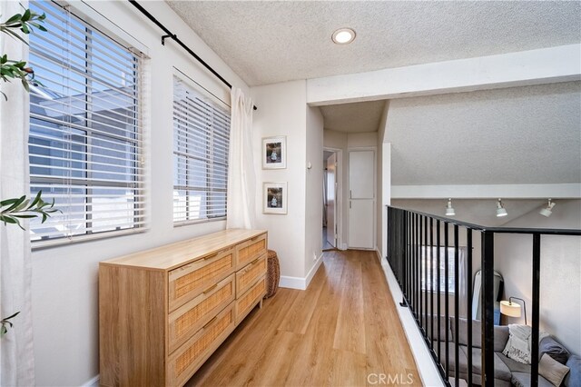 818 Live Oak Pl, Corona, CA 92882 - hallway with a textured ceiling and light wood-style flooring