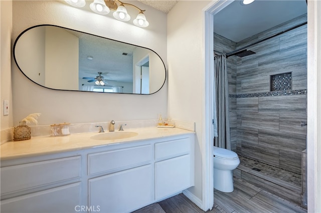 818 Live Oak Pl, Corona, CA 92882 - bathroom with tiled shower, vanity, and ceiling fan