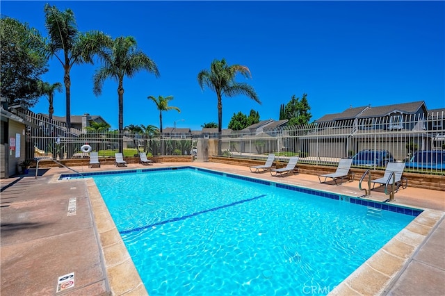 818 Live Oak Pl, Corona, CA 92882 - community pool featuring a residential view and a patio area