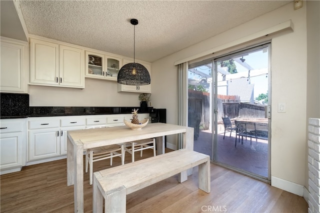 818 Live Oak Pl, Corona, CA 92882 - dining space with light wood-type flooring and a textured ceiling