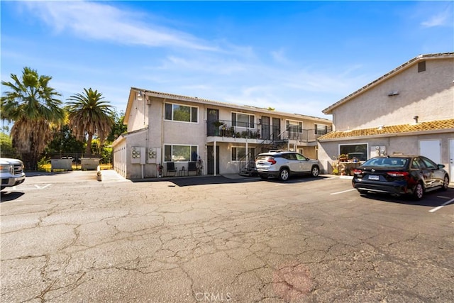 351 W 19th St, Merced, CA 95340 - view of front of property with uncovered parking and stucco siding