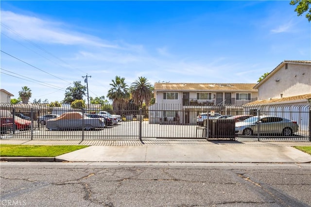 351 W 19th St, Merced, CA 95340 - view of front facade with a fenced front yard, uncovered parking, and a gate