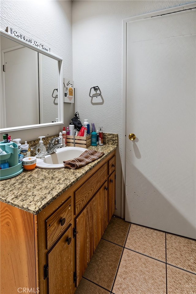 351 W 19th St, Merced, CA 95340 - bathroom featuring tile patterned floors and vanity