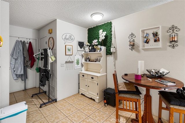 351 W 19th St, Merced, CA 95340 - dining space featuring light tile patterned floors and a textured ceiling