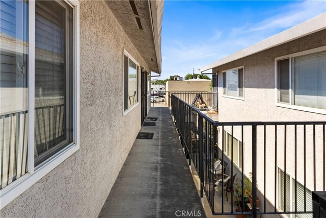 351 W 19th St, Merced, CA 95340 - view of side of property with stucco siding and a balcony