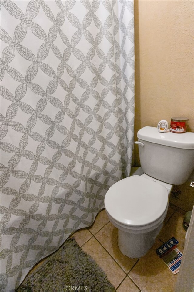351 W 19th St, Merced, CA 95340 - bathroom featuring tile patterned flooring and curtained shower