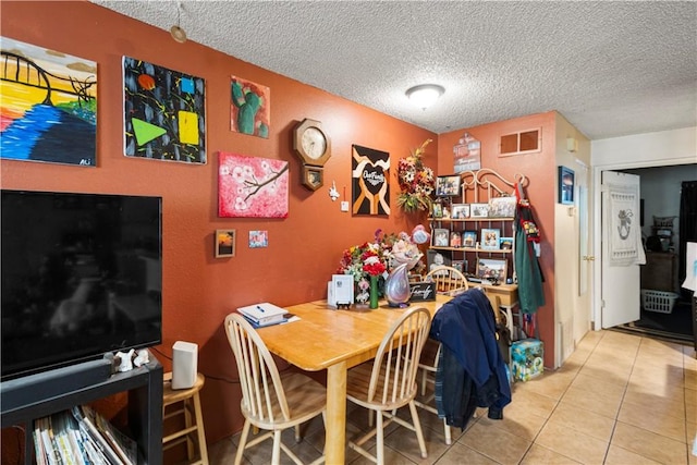 351 W 19th St, Merced, CA 95340 - tiled dining room featuring a textured ceiling