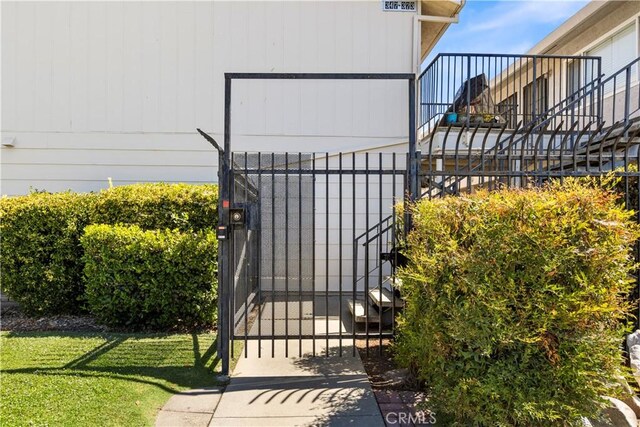 351 W 19th St, Merced, CA 95340 - gate featuring a lawn