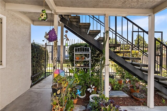 351 W 19th St, Merced, CA 95340 - view of patio featuring stairs and a gate