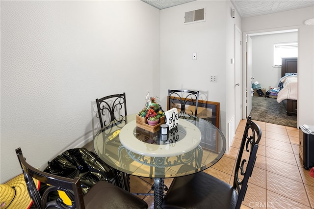 351 W 19th St, Merced, CA 95340 - dining area with light tile patterned floors and a textured ceiling
