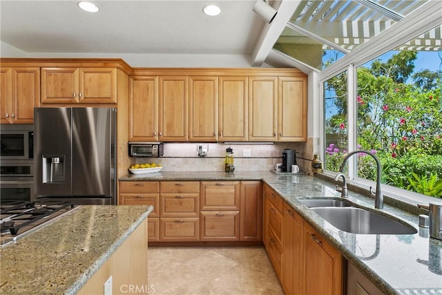 23256 Arelo Ct, Laguna Niguel, CA 92677 - kitchen with stainless steel appliances, healthy amount of natural light, decorative backsplash, light stone counters, and recessed lighting
