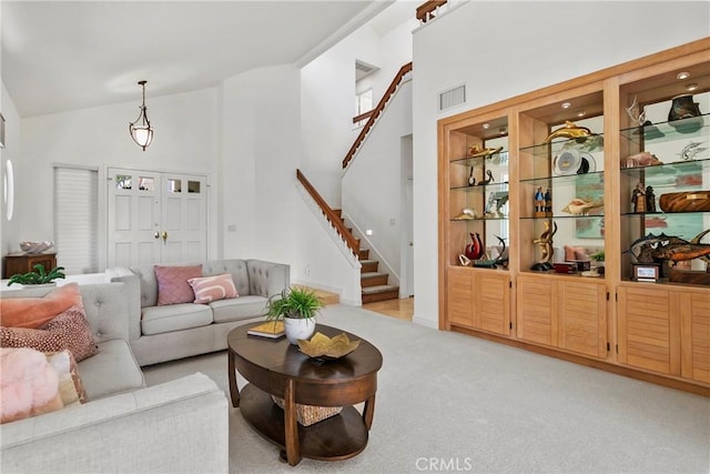 23256 Arelo Ct, Laguna Niguel, CA 92677 - living area with stairs, high vaulted ceiling, and light colored carpet