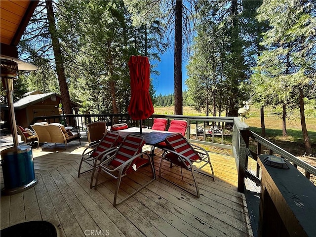 9312 Mountain Meadow Rd, Shingletown, CA 96088 - wooden terrace with outdoor dining area and an outdoor hangout area