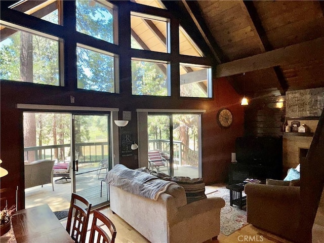 9312 Mountain Meadow Rd, Shingletown, CA 96088 - living area with high vaulted ceiling and a wood ceiling with exposed beams